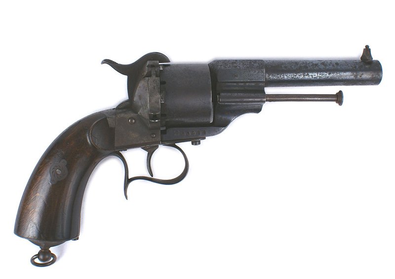 Civil War type French Lefacheaux revolver: M-007 Civil War type French Lefacheaux pin fire revolver. Retains most of the blue finish on the barrel, frame, cylinder, trigger guard, etc. Shows some age spotting. Hardwood grips with a lanyard rin