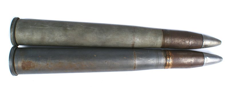 U.S. Navy WWII 40mm cartridge casings: M-042 Lot of 2 U.S. Navy WWII 40mm cartridge casings. Both complete with the projectile. 17 3/4" tall. Weight 7 1/2 lbs. II