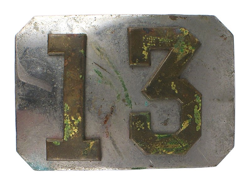 U.S. Militia belt plate Mid 19th Century: K-025 U.S. Militia belt plate. Slightly convex nickeled, rectangular in shape, with clipped corners and an affixed large number "13". Mid 19th Century. II