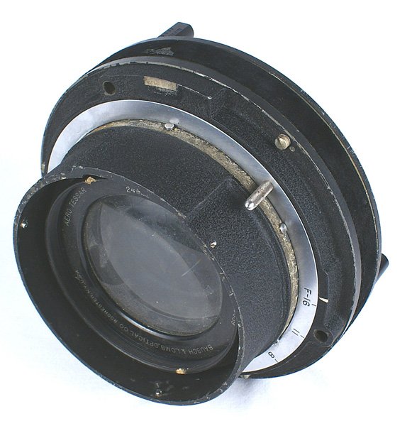 U.S. Aerial camera lens/casing BAUSCH & LOMB: N-082 U.S. Aerial camera lens/casing. Marked "ARROW TESSAR", "FOCAL LENGTH 25IN. (610MM)", and "BAUSCH & LOMB OPTICAL CO. ROCHESTER NY U.S.A.". Metal tags identify "SHUTTER K-38" and "INITIAL TENSION 