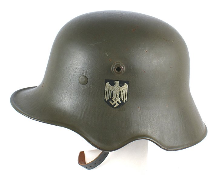 German WWII Army cut-out helmet: E-073 German WWII Army double decal "cut-out" helmet. Professionally restored. O.D. finish with original decals (eagle/swastika and National Colors). Original leather liner is ink stamped with name of