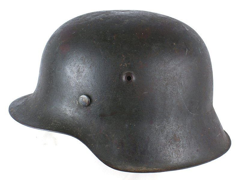 German WWII Army M1942 helmet: E-128 German WWII Army M1942 helmet. Aged patina on the original green finish which shows the expected scratches and scuffs from field wear. Leather liner shows some wear stains. No Chinstrap. A good 