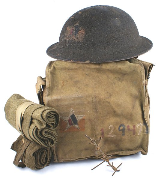 U.S. WWI 2nd Division helmet gas mask: E-142 U.S. WWI 2nd Division, 12th Field Artillery, 2nd Battalion "doughboy" helmet. Sand finish painted with the Indian head/star insignia. Shows some wear. With liner (loose) and chinstrap. Also with