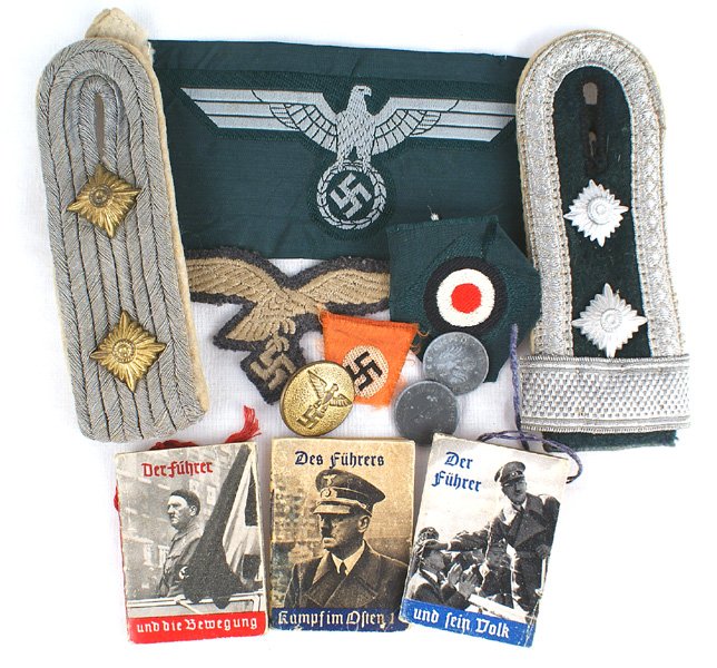 Lot Luftwaffe EM M1943 cap eagle etc: E-248 Miscellaneous lot: (1) Luftwaffe EM M1943 cap eagle. Was removed from a cap. (2) Infantry single shoulder boards - Captain and NCO. (3) Army EM breast eagle - uncut. (4) Army bevo cap rosette an
