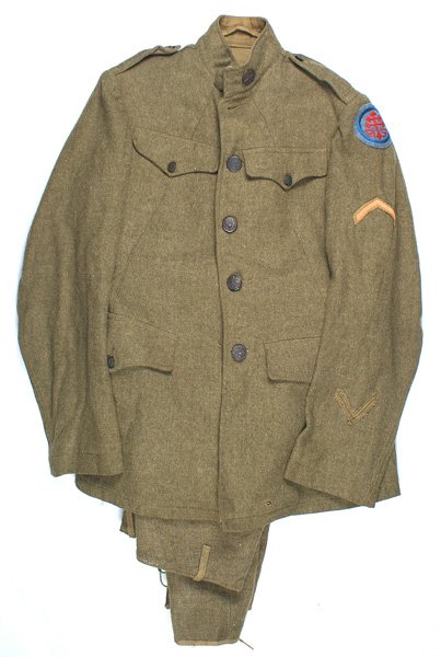 U.S. WWI Sector of Supply Quartermaster uniform: F-031 U.S. WWI Advance Sector of Supply/Quartermaster uniform: Wool four hidden pocket, stand-up collar tunic. Has both collar discs - "USNA" and Quartermaster insignia. "Cross of Lorraine" shoulder p