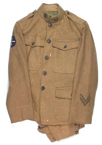 U.S. WWI Signal Corps Aviation Section uniform: F-032 U.S. WWI Signal Corps/Aviation Section uniform: Wool four-pocket stand-up collar tunic. Has both collar discs - "US" and winged prop. Embroidered white on blue four-bladed propeller patch on rig