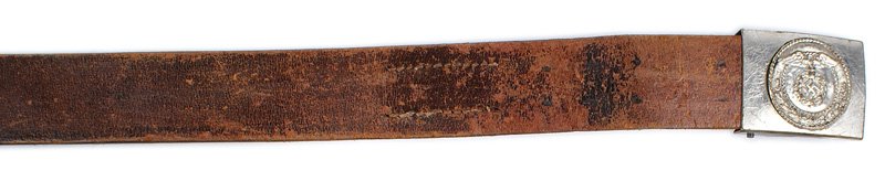 German WWII NSKK belt: F-102 German WWII NSKK belt and buckle. Roundel is similar to the early N.S.D.A.P./SA but was silvered on a nickeled background. Someone tried to de-Nazify this buckle by prying up the sides of the ro
