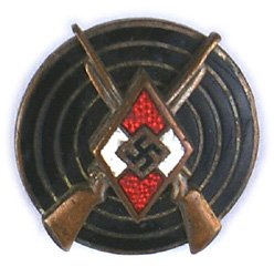 German WWII HJ Hitler Youth Marksman Badge: B-056 German WWII H.J. (Hitler Youth) Marksman's Badge. Enameled H.J. "diamond"/crossed bronze rifles on a black enameled target. Reverse marked "RZM M1/63". II