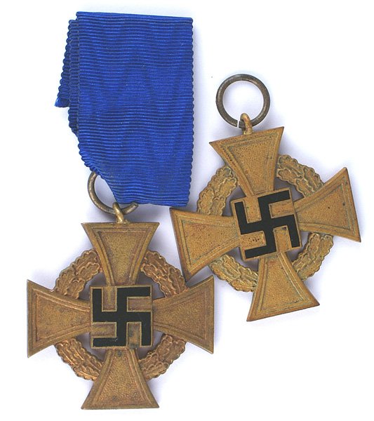 Lot of 2 German WWII Gold Loyalty Crosses: B-071 Lot of 2 German WWII Gold Loyalty Crosses. Both have darkened to dull finish. One of the rings is marked "1" (Deschler & Sohn in Munich). One has section of blue ribbon. II-