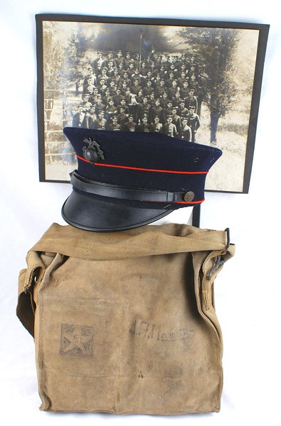 USMC WWI 2nd Division named group cap Gas mask etc: S-004 WWI - USMC 2nd Division named group: (1) U.S.M.C. blue peaked cap with red piping. Eagle/globe/anchor badge. Black leather chinstrap with 2 EGA buttons. Woven bamboo frame, Leather sweatband nam