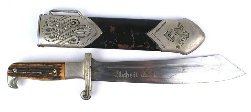 German WWII RAD M1934 hewer dagger: D-019 German WWII RAD (Labor Corps) M1934 hewer. Nickeled beak and crossguard with staghorn grip. 9 3/4" scimitar-shaped blade with an angled "clipped point". Engraved with the motto "Arbeit Adelt" (L