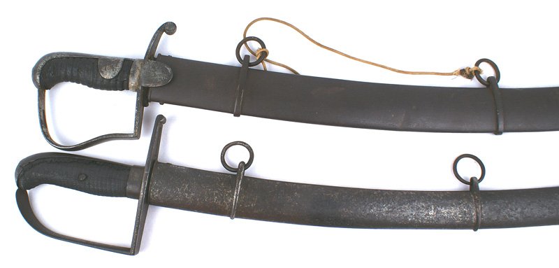 Lot of 2 Napoleonic era German Cavalry swords: D-033 Lot of 2 Napoleonic era German Cavalry swords: (1) Prussian M1811 "Blucher" pattern. Well worn steel one-piece pommel backstrap with side extensions, Reverse "P" knuckle bow/crossguard with lang