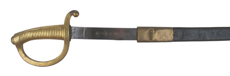 Spanish Infantry sword 1897: D-065 Spanish Infantry sword. One-piece solid brass ribbed grip/reverse "D" knuckle bow/crossguard. 27 5/8" slightly curved blade with some dark splotches on the reverse and along the spine. Marked "A