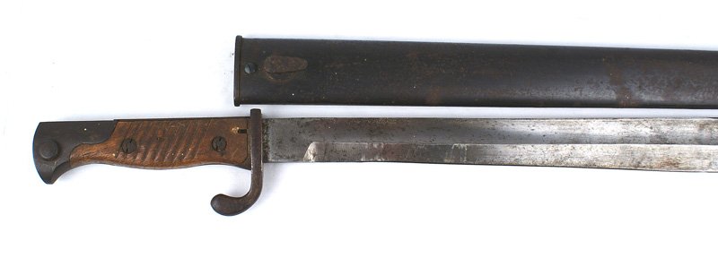 German M1898/05 butcher bayonet: D-066 German M1898/05 "butcher" bayonet. 14 1/4" blade which is starting to gray with some dark splotches. Maker marked "SCHLEUTERMAN - REMSCHEID". Ribbed wood grips with darkened steel fittings. 60% 