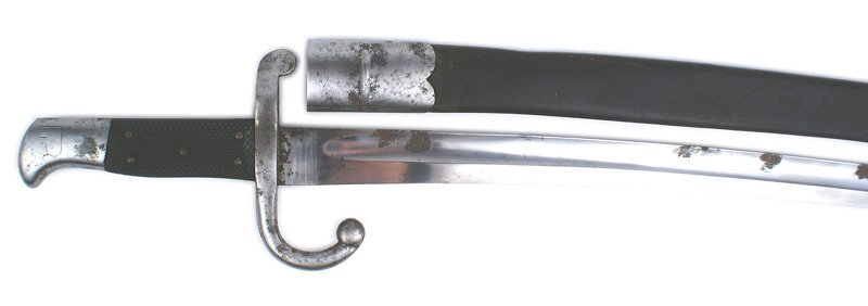 Danish M1867 saber bayonet: D-102 Danish M1867 saber bayonet - second pattern. Checkered black leather grips with 5 steel rivets. Steel crossguard/muzzle ring with a turned-down ball quillon. Crown proof mark on steel pommel. 21