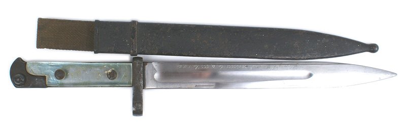Russian M1938 Tokarev rifle bayonet: D-106 Russian M1938 Tokarev rifle bayonet. Darkened "bird head" pommel and guard/muzzle ring. Period clear plastic grips. Excellent 9 5/8" blade is quality script engraved "Sgt. George E. Warwick...Co