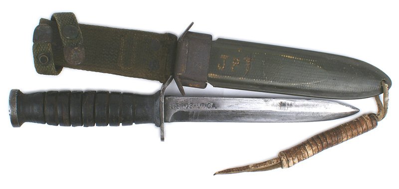 U.S. WWII M3 combat knife: D-146 U.S. M3 combat knife. Leather rings grip. Flat steel pommel and slightly curved downward crossguard. 6 5/8" gray blade is marked "US M3 UTICA". Reverse is stamped "A174". M8 fiber scabbard has i