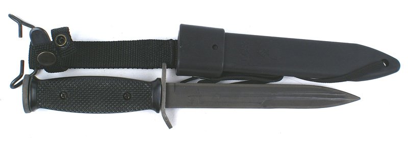 U.S. WWII M3 combat knife: D-152 U.S. M3 combat knife - with checkered black plastic grips. Parkerized 6 5/8" blade and fittings. Crossguard is marked "US" and "IMPERIAL". Has 2 "punch" marks. Black plastic scabbard is marked "
