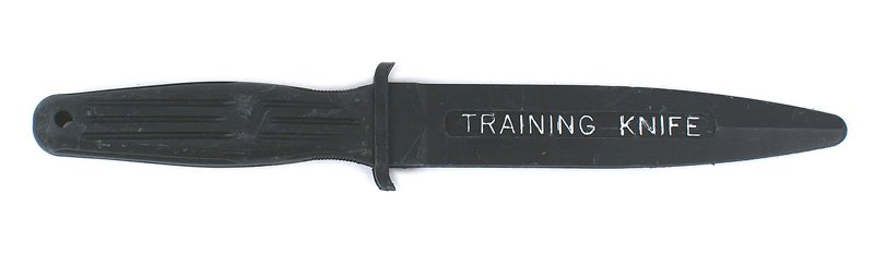 U.S. instructional knife TRAINING: D-241 U.S. black rubber instructional knife. One-piece ribbed grip with a 6 1/2" blade marked "TRAINING KNIFE". "USA" on reverse. Probably used for hand-to-hand combat training at the Army Ranger Scho