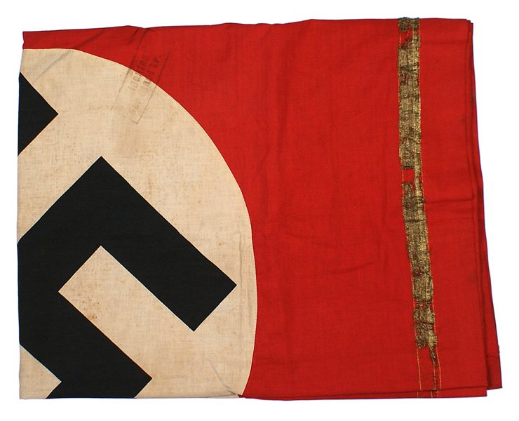 German WWII NSDAP Podium Banner: H-061 N.S.D.A.P. Podium Banner. Black printed swastika on a 23 1/2" diameter white disc, sewn to red field. 1" wide gold wire inner border (separating from age). Stamped "Property of the City of Trier