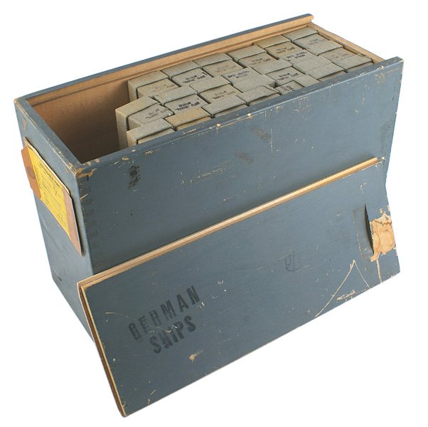 U.S. Navy WWII model ships German Destroyer: H-145 U.S. Navy WWII wood case with 21 metal I.D. model ships of the German "Narvik" Class Destroyer. Each is a detailed 4" model in an original gray paint finish. Each is separately wrapped in an ide