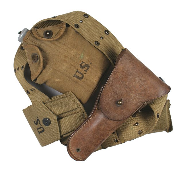 U.S. WWII combat web belt holster: M-017 U.S. WWII combat web belt. Dated "1942". With: (1) Brown leather .45 cal. pistol holster made by "WARREN LEATHER GOODS CO". (2) Bandage pouch with unopened bandage kit. (3) Web pouch for two pis