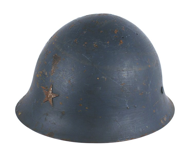 Japanese WWII Navy helmet: E-048 Japanese WWII Navy helmet. Standard military issue, but painted blue. Finish worn from star. Several chipped areas. Missing liner and straps. II-