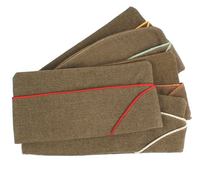 Lot of 6 U.S. WWII Army o'seas caps: E-102 Lot of 6 U.S. WWII Army officer o'seas caps. All with leather sweatbands and silk type linings: (1) Artillery- red piping. (2) White piping. With "7 1/8" size tag. (3) Armor - with green/white p