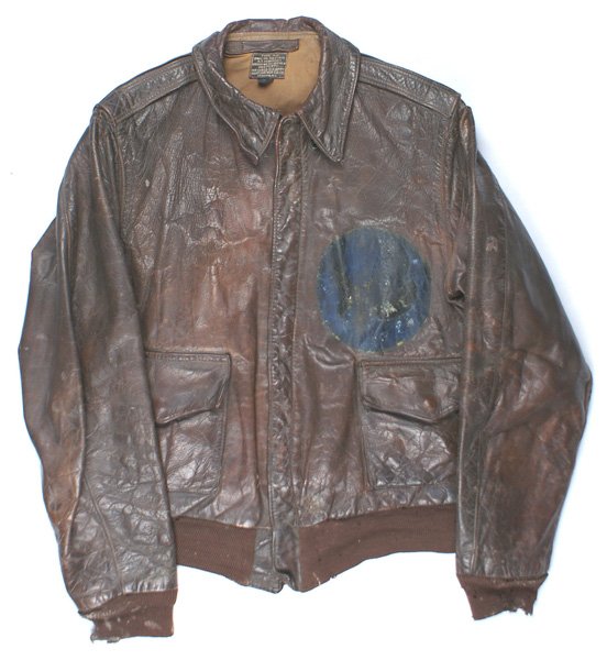 U.S. WWII Army Air Force A-2 leather jacket: F-075 U.S. WWII Army Air Force A-2 two-pocket leather jacket. Well used with a large blue oval remaining from the painted unit insignia. Moth spots on the knit cuffs and waist band. Painted reverse wi