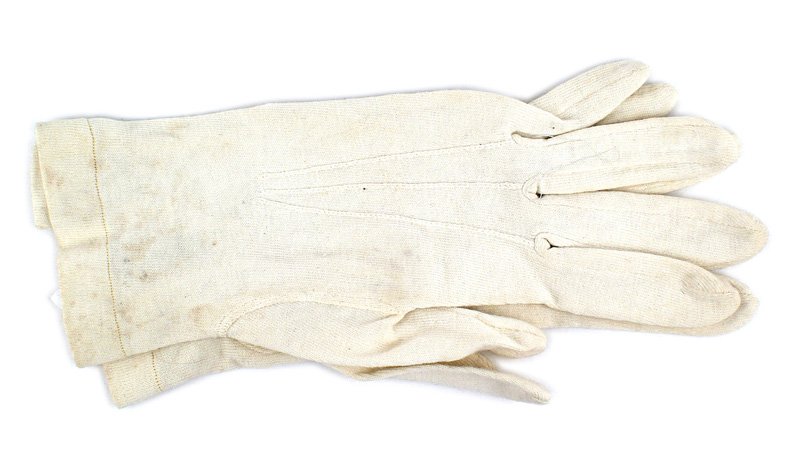German WWII Army dress gloves: F-119 German WWII Army Officer's white dress gloves. Ribbed material with a linear design. Age toned simulated ivory buttons. Stamped with a serial number "9552". II