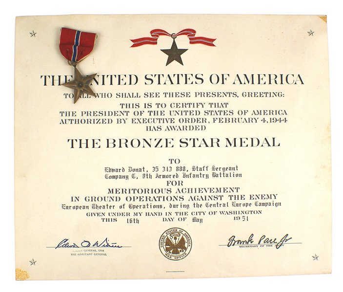 U.S. WWII Bronze Star Slot brooch with certificate: B-160 U.S. WWII Bronze Star. Unnamed. Slot brooch. With the certificate awarded to Edward Donat of the 8th Armored Infantry Battalion for the "European Theater of Operations, during the Central Europe