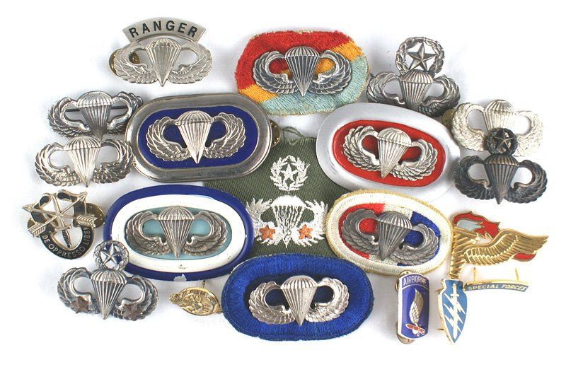 Lot of 14 U.S. Paratrooper wings WWII - 1950: B-197 Lot of 14 U.S. Paratrooper "wings". Includes: (1) Three "STERLING" Badges mounted on background ovals (possibly late WWII - 1950), one unmarked on a 3-color background oval. (2) Two Paratrooper 
