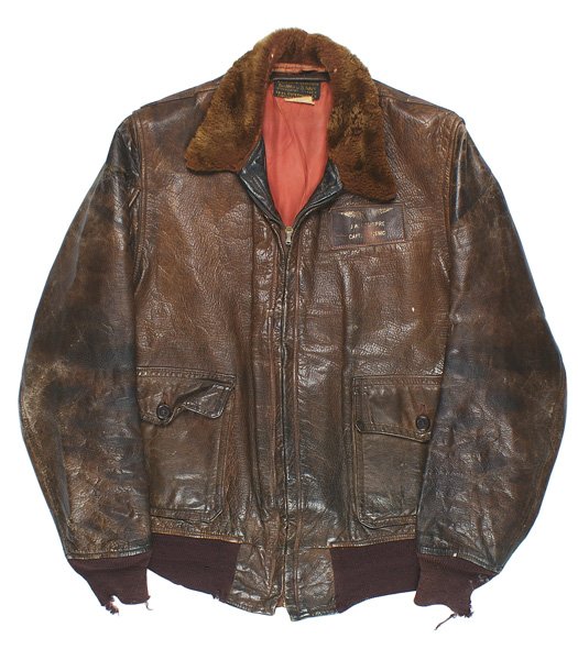 USMC WWII pilot leather jacket: S-007 USMC WWII pilot's leather jacket. Navy-type with a fur collar. Leather name tag with gilt wings "J. W. LONGPRE - CAPT. USMC". Cloth cuffs are torn. II-