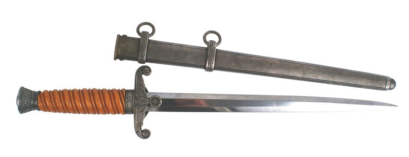 German WWII Army Officer dress dagger: D-002 German WWII Army Officer dress dagger. Age toned oak leaf decorated pommel and crossguard bearing an eagle/swastika. Bakelite orange grip. 10 1/8" clean blade marked with the Knights helmet logo