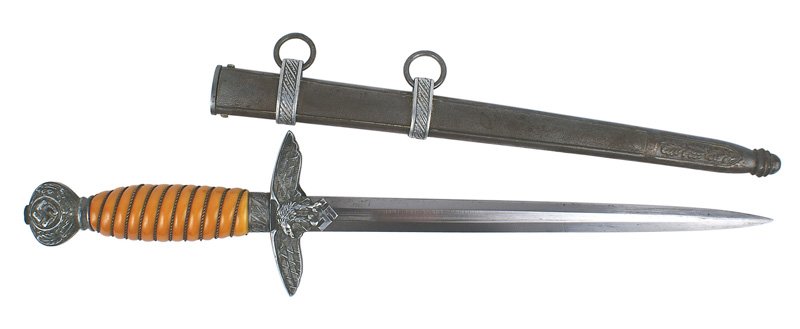 Luftwaffe 2nd Model dress dagger: D-006 Luftwaffe 2nd Model dress dagger. Twisted wire wrapped orange grip. Oak leaf decorated ferrule and pommel with a relief swastika. Flying eagle/swastika crossguard. 10 1/8" fairly clean blade mar