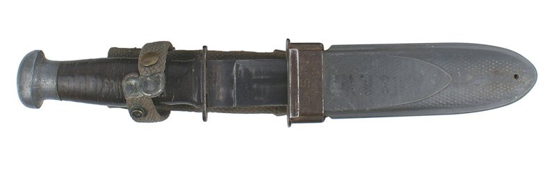 U.S. WWII Robeson WWII Navy knife: D-041 Robeson WWII Navy knife. Leather rings grip and an oval aluminum pommel. 5 1/4" blued blade retains 85% of the finish. Marked "U.S.N. - M.K.1" and "ROBESON Shur Edge No. 20". Gray fiber scabbard