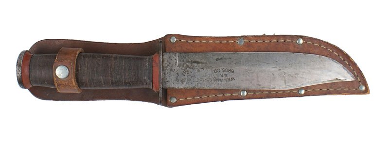 U.S. WWII fighting knife: D-043 WWII fighting knife. Flat round steel pommel and short crossguard. Leather rings grip. 6" "KA-BAR" type blade. Marked "WILLIAMS - S.F. - BROS. CO.". A clean blade with scattered gray "water spat