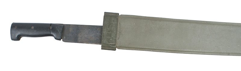 U.S. WWII machete: D-054 WWII machete. Black bakelite grip (cracked). 17 7/8" blackened blade. Marked "MADE IN ENGLAND". O.D. canvas/plastic flexible body scabbard. Metal throat marked "US". Reverse marked "B.M.Co. -194