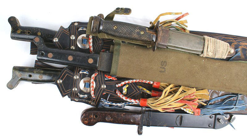 Lot of 5 US WWII machetes M7 bayonet: D-057 Lot of 5 edged weapons: (1) US WWII machete. Bakelite grip. Excellent 18" blued blade. Marked "USMC - MK2 - 1944 - SWI". With a canvas scabbard. (2) South American machete. Bakelite grip. 22" "m