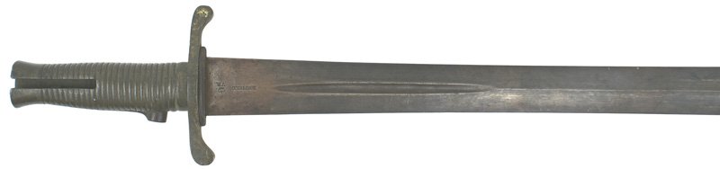 British Brunswick M1847 sword bayonet: D-068 British Brunswick M1847 sword bayonet. Ribbed brass grip with a press catch near the crossguard. Unit stamped with a large "D34". 22 1/8" double-edged age darkened blade (will clean). Marked "EN