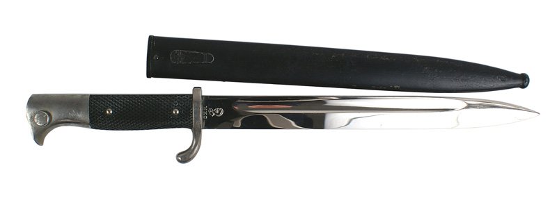 German WWII K98 Mauser dress bayonet: D-073 German WWII K98 Mauser dress bayonet. Nickeled "bird head" pommel and turned-up crossguard. Checkered black plastic grips. Excellent 9 3/4" blade - marked with a knights helmet logo and "WKC". B