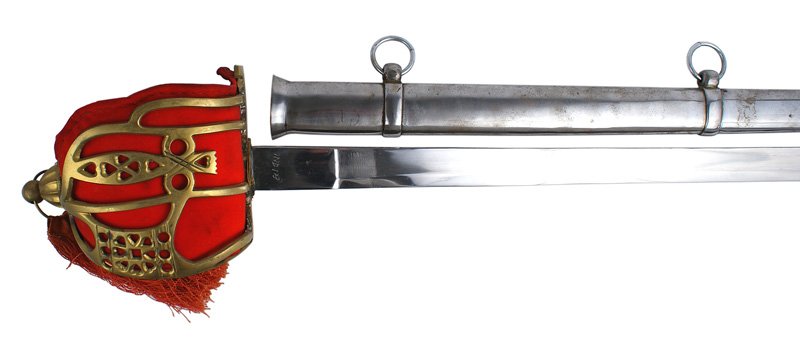 Reproduction Scottish Claymore sword: H-178 Reproduction Scottish Claymore. Large pierced brass basket guard with a rounded finial holding a tassel decoration. Twisted wire wrapped leather grip. Heavy red felt cushion insert. 34 1/2" exce
