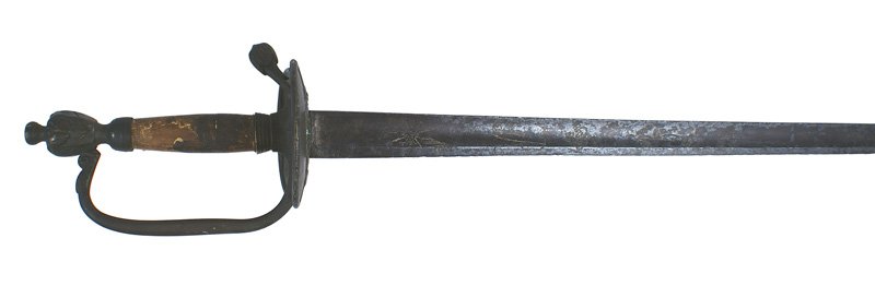 Named British officer sword Revolutionary War: K-002 Named British officer's sword with an American attribution. Age darkened brass urn shaped pommel/finial and reverse "D" knuckle-bow. Wire wrapping is missing from the wood grip. Slightly turned-