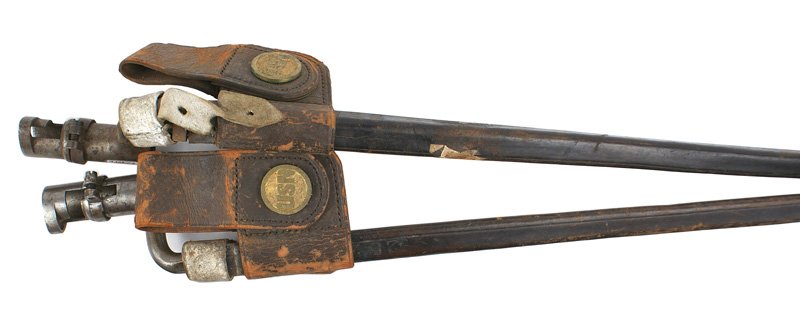 Lot of 2 U.S. Navy socket bayonets Circa 1870: K-070 Lot of 2 U.S. Navy socket bayonets. 17 5/8" triangular blades marked "US". Both have darkened patches. Leather scabbards with a leather frog having a brass "USN" swivel holding a belt loop. Circ
