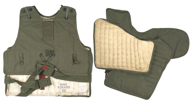 U.S. WWII two-piece body armor Flak: N-035 U.S. WWII two-piece body armor. Flak set primarily designed for air crews of the B-17. The set consists of: (1) Vest (M1 and M2). Front and back held together by "lift dots" with a "tug strap" a