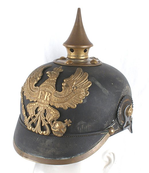 Imperial German Prussian NCO pickelhaube: E-008 Imperial German Prussian NCO "pickelhaube". Solid black leather body shows some surface "spider lines" on the reverse. Brass eagle front plate, spike/round base/domed rivets, visor trim and spin