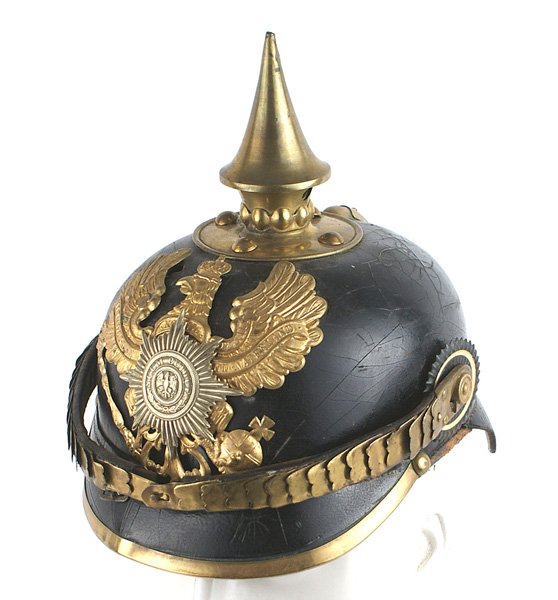 Imperial German Prussian NCO School helmet: E-014 Imperial German Prussian NCO School helmet. Solid black leather body showing some surface crazing and "spiders" on the top and the back visor. Brass round short spike/base, visor trim and spine.