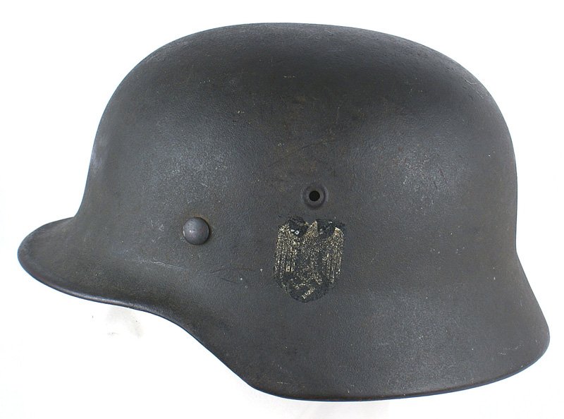 German WWII Army M1940 helmet: E-037 German WWII Army M1940 helmet. Original green finish shows some minor wear. Army eagle/swastika decal shows wear. Leather liner is worn along the edges. No chinstrap. About II