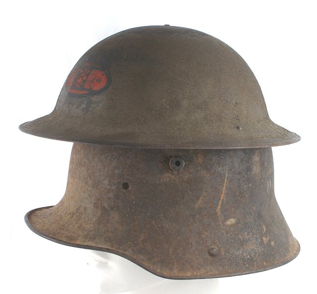 Lot of 2 WWI helmets German US Doughboy: E-070 Lot of 2 WWI helmets: (1) German M1916. Pitted and rusted with some small areas with traces of the original light green paint. Shell only. Relic condition. (2) US "Doughboy". Rough OD finish wit