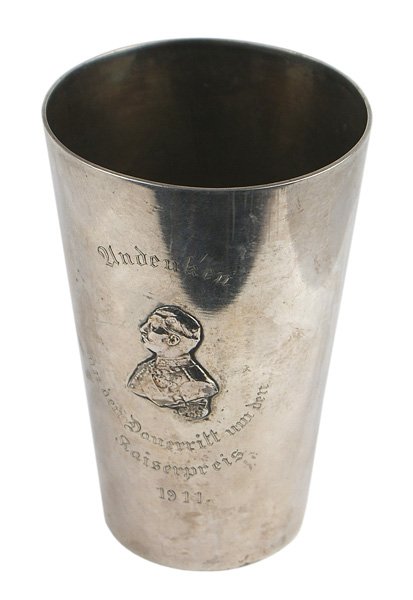Silver Kaiser Wilhelm II presentation cup: A-006 Silver Kaiser Wilhelm II presentation cup. Tapered 4 3/4" silver cup bearing a relief profile of the Kaiser and engraved "Andenken an den Dauerritt um den Kaiserpreis 1911". Reverse is named to 